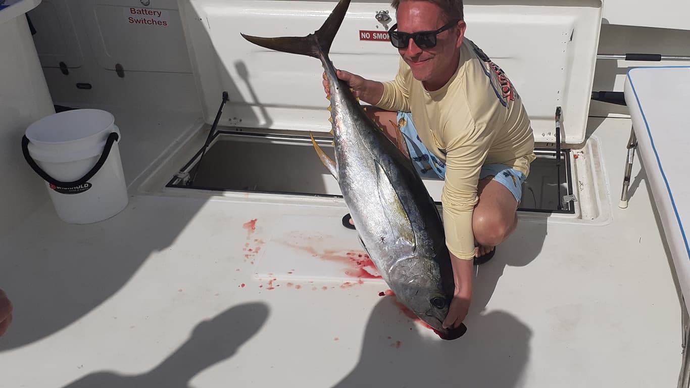 Fishermn holding a 40 pound Yellow Fin Tuna